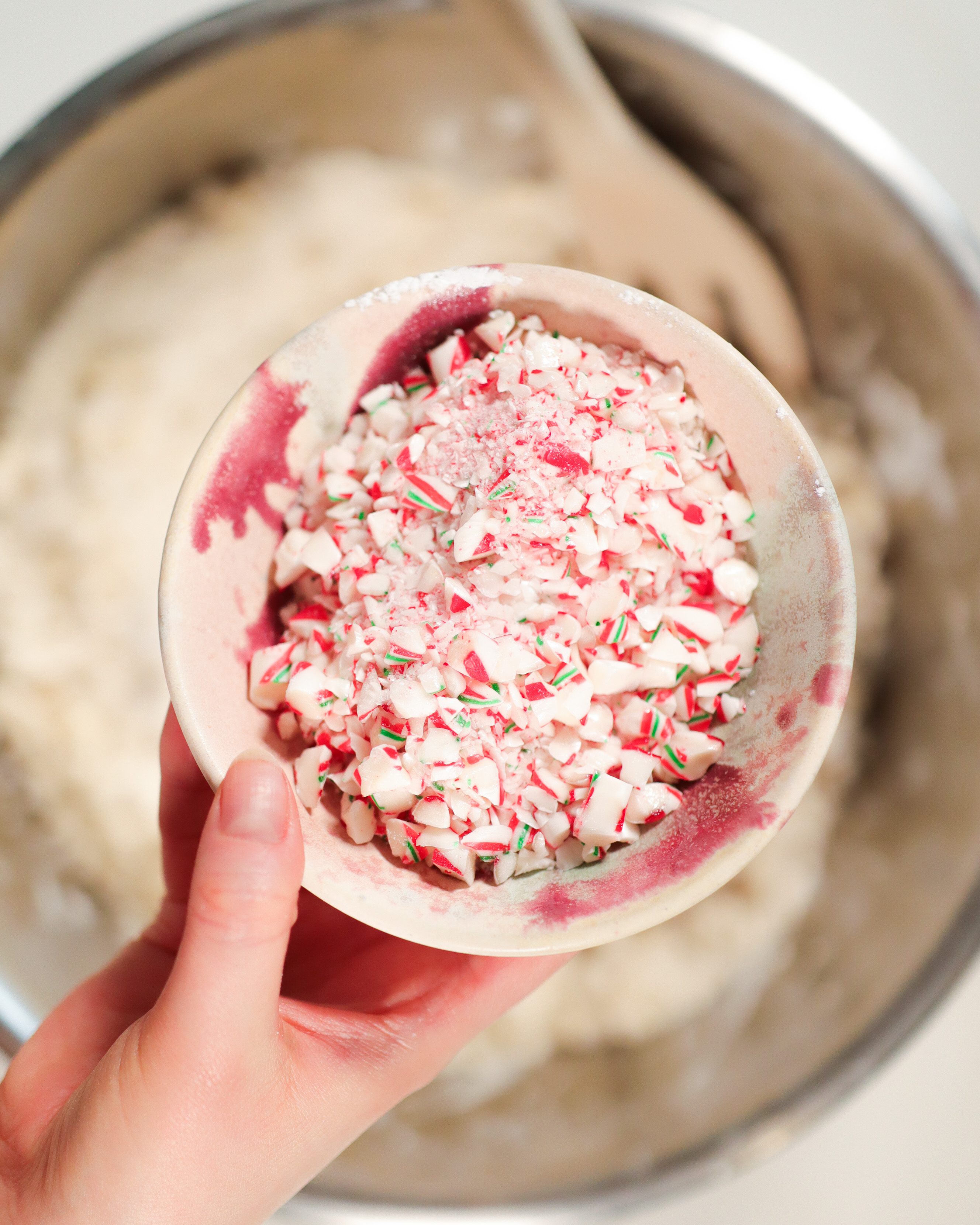 hand showing ingredients for candy cane shortbread