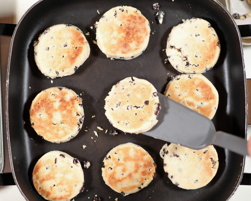 Welsh tea cakes cooking on a skillet