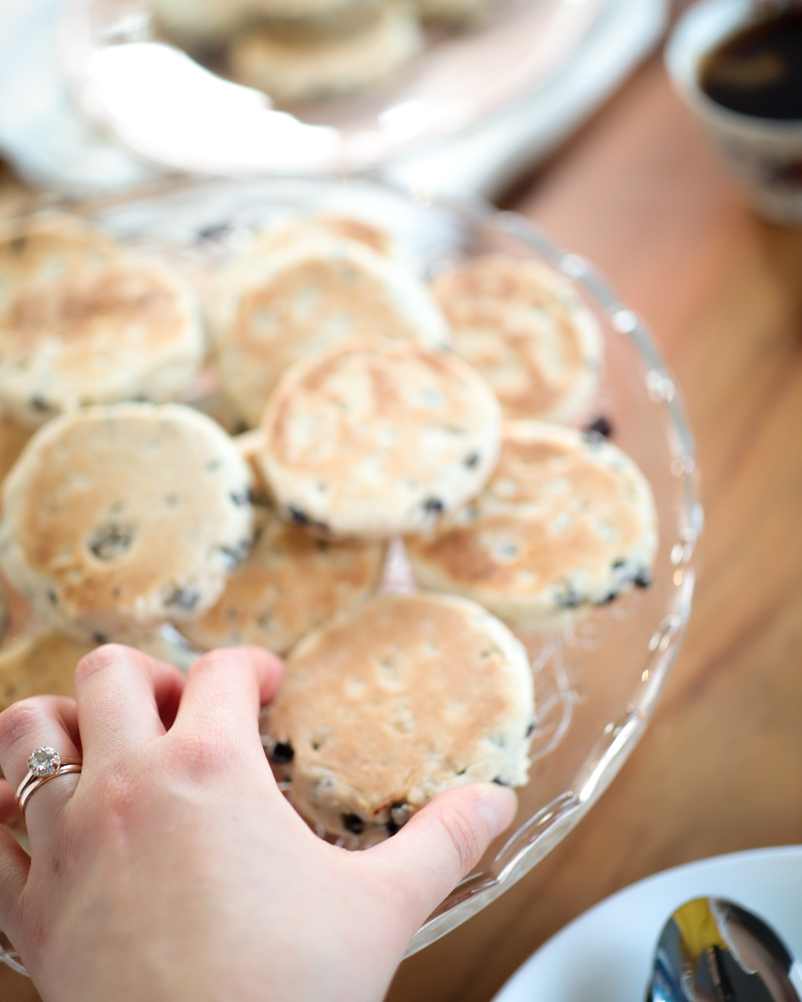 a hand reaching for a baked treat