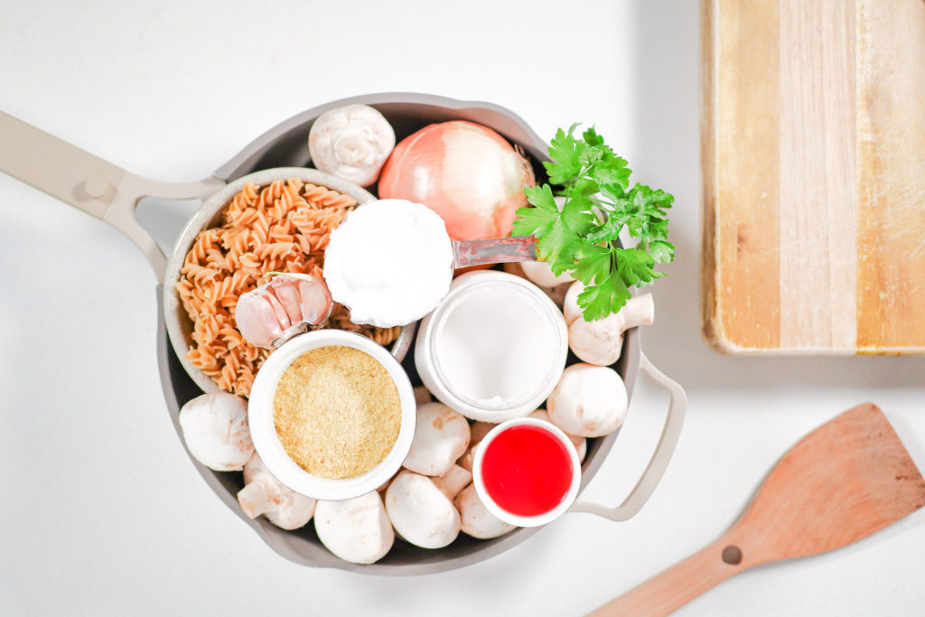 saucepan with several ingredients on displayed.