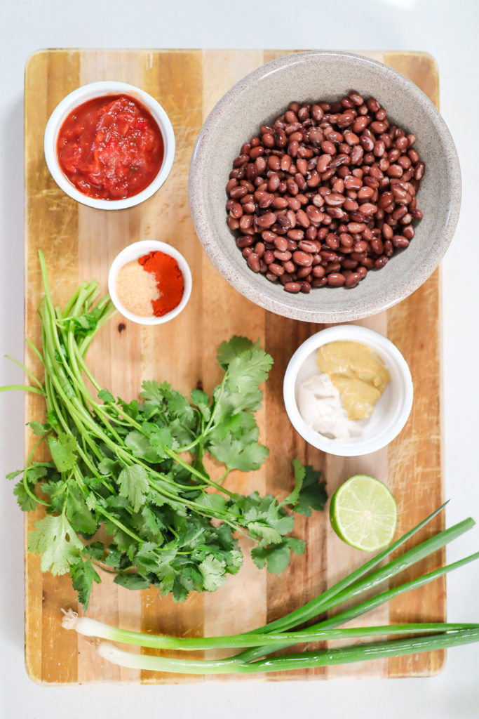 wood cutting board with ingredients on top