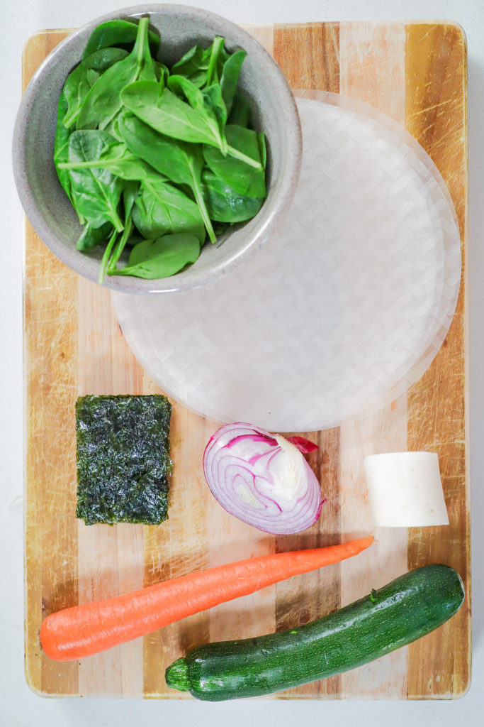 variety of veggies on top of a wooden cutting board