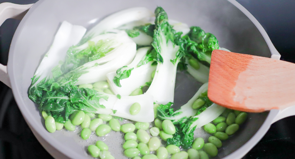 Vegetables cooking in a saucepan.