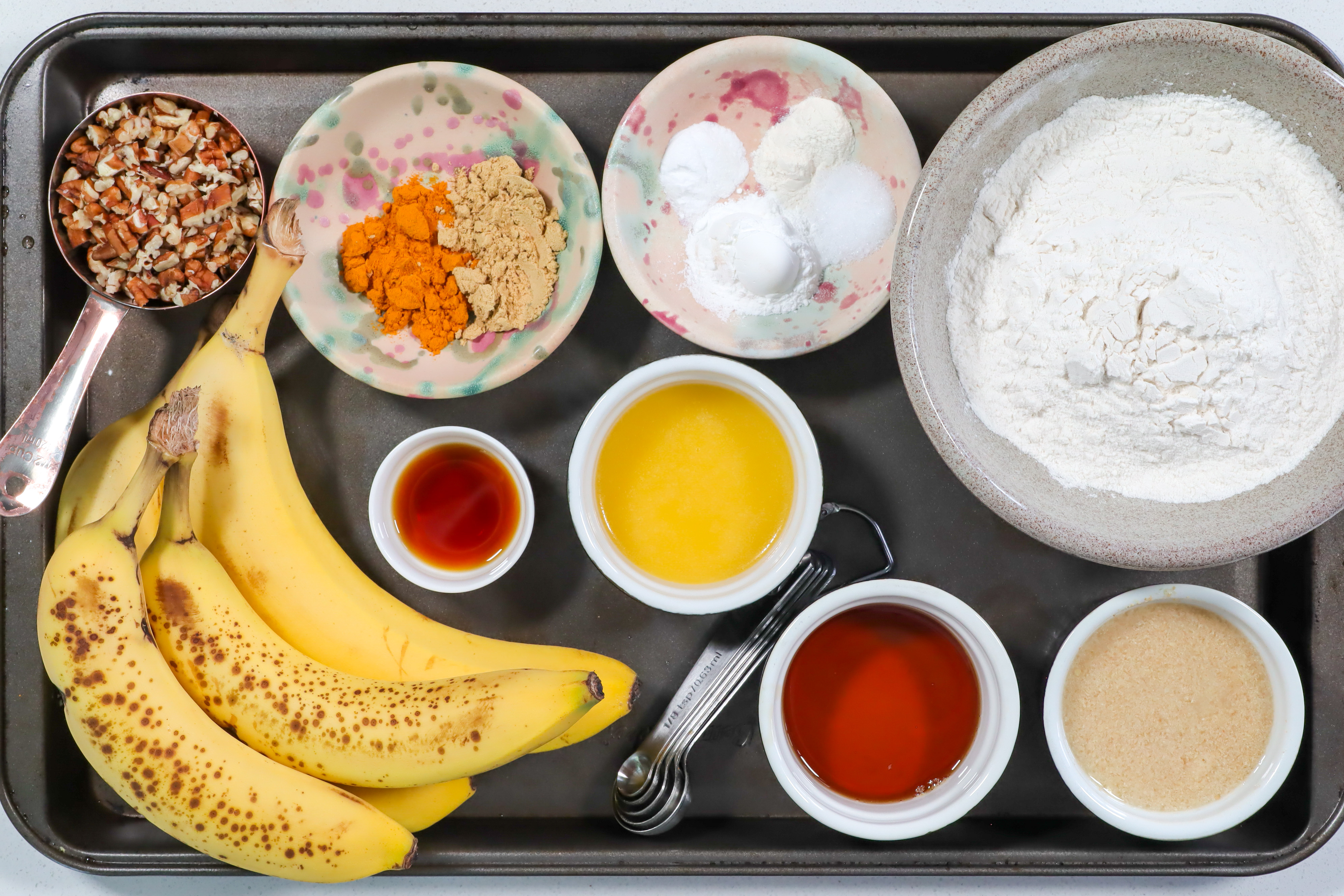 Muffin ingredients on a baking tray.