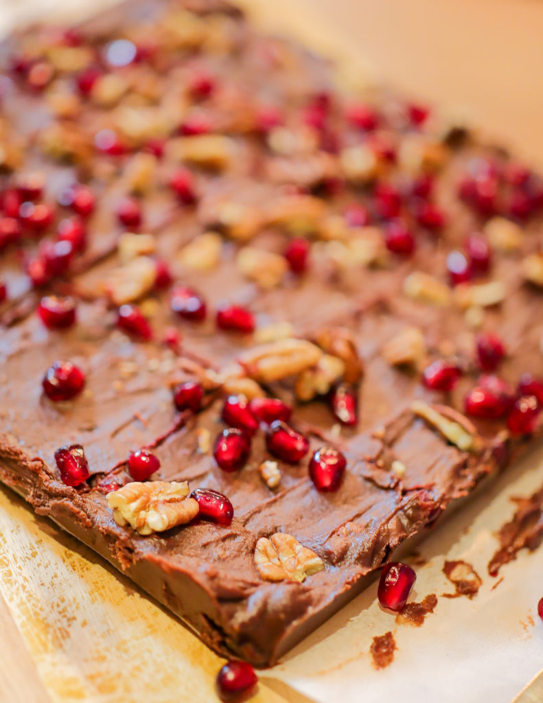 Sheet of fudge with berries and nuts.