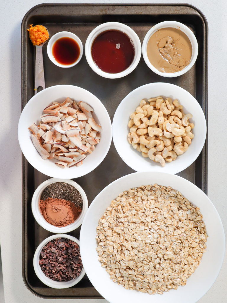 granola recipe ingredients displayed on a baking tray