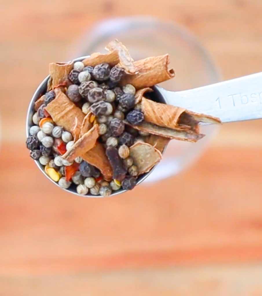 close-up shot of spoon full of whole spices