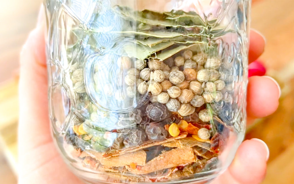 jar of whole spices and herbs